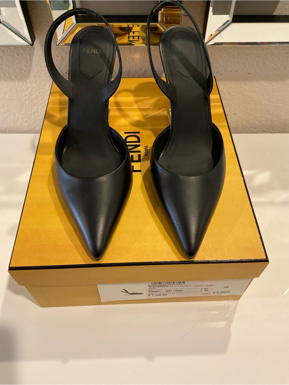 FENDI black leather Fendi slingback pumps featuring a sharp pointed toe size 38